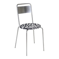 Zebra-patterned round seat with sleek silver metal frame. Stylish black and white design for modern decor.