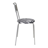 Zebra-patterned seat with monochrome black and white colors on a sleek, silver metal chair frame.