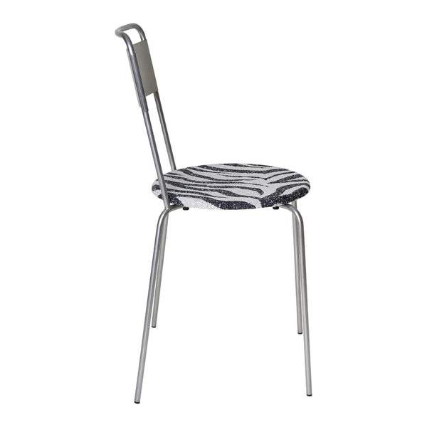 Zebra-patterned seat with monochrome black and white colors on a sleek, silver metal chair frame.