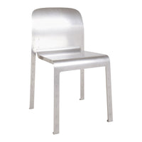 Silver metal chair with a sleek, minimal design and smooth finish. Perfect for modern decor.