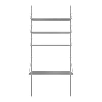 Gray metal shelving unit with sleek lines and minimalist design, featuring four open shelves.