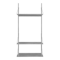 Gray metal shelving unit with three sleek, open shelves, featuring a modern, minimalist design.