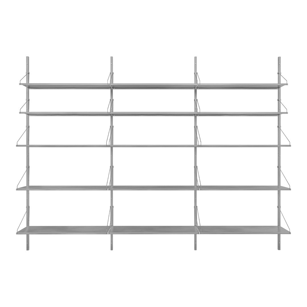 Sleek silver metal shelving unit with multiple open shelves for a modern and minimalist display.
