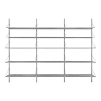 Sleek silver metal shelving unit with multiple open shelves for a modern and minimalist display.
