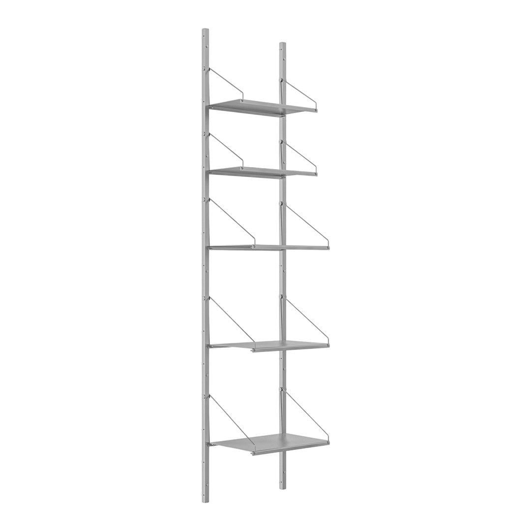 Slim metal shelving unit with a sleek silver finish and minimalist design, featuring open framework and flat shelves.