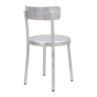 Metallic silver chair with a minimalist design, featuring a smooth, shiny finish and no patterns. Perfect for modern decor.