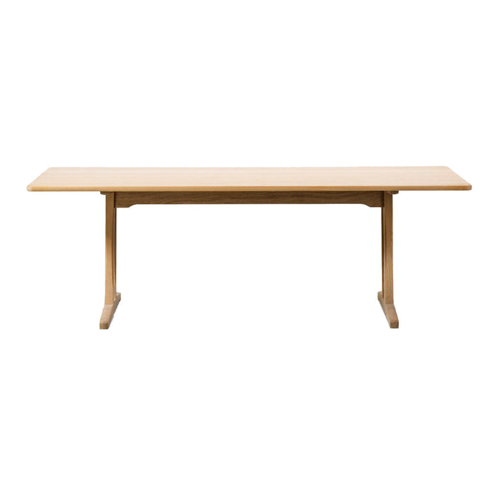 Natural wood dining table with a light beige finish and clean, minimalist design. Perfect for modern interiors.