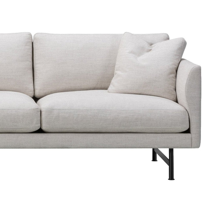 Light beige linen fabric sofa with plush cushions and minimalistic black metal legs, featuring a simple and modern design.