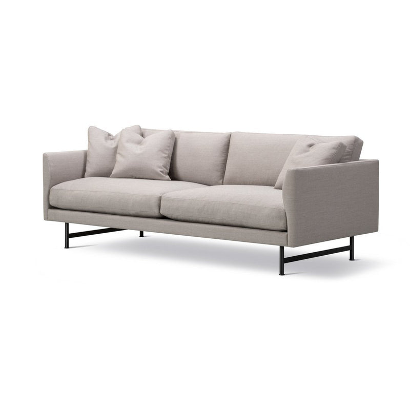 Light grey fabric sofa with a minimalist design and plush cushions, featuring a sleek black metal frame.