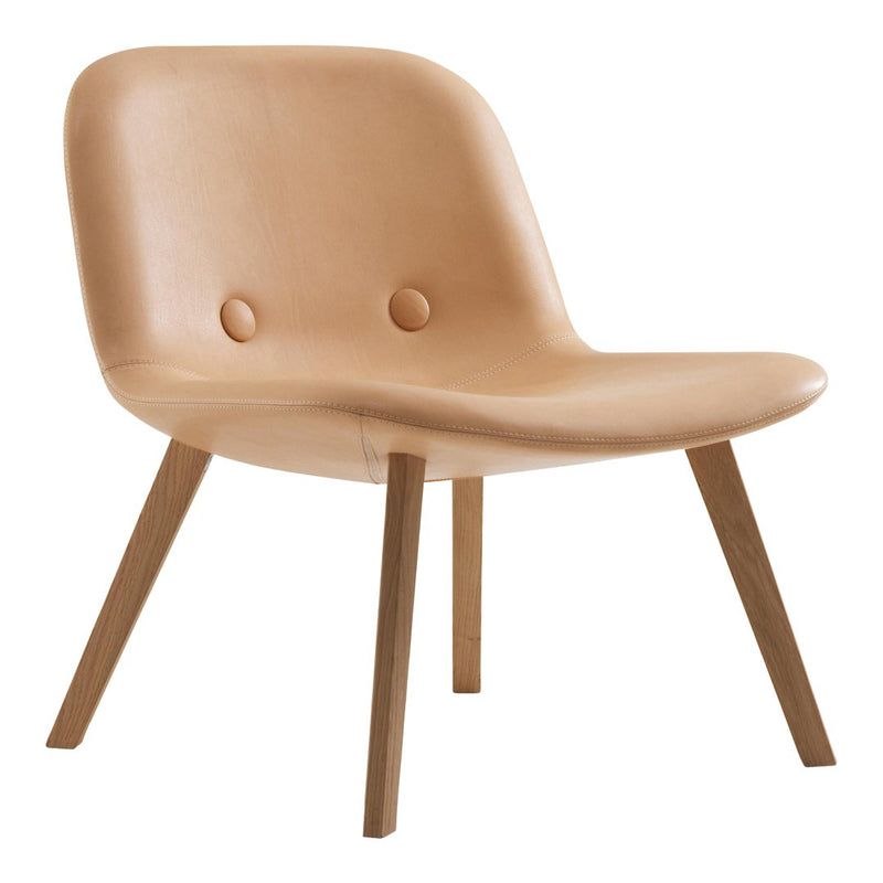 Tan leather chair with minimalist design and natural wood legs, featuring subtle button accents for added style.