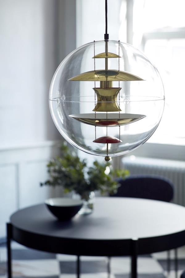 Transparent glass pendant light with yellow and red accents, featuring a modern, layered design for a stylish look.