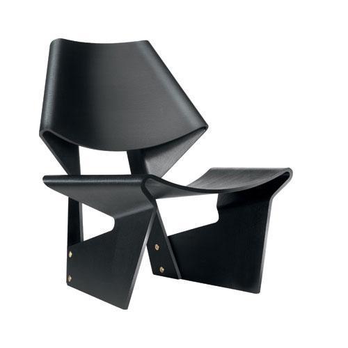 Sleek black chair with a modern geometric design, featuring smooth curves and sharp angles for a unique aesthetic.