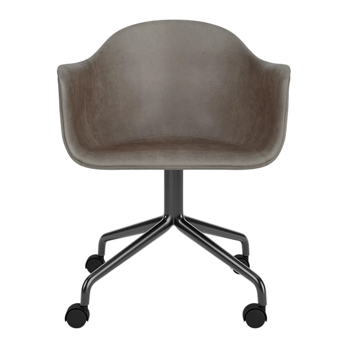 Gray upholstered chair with a smooth finish and a sleek black metal base, featuring a minimalist design.