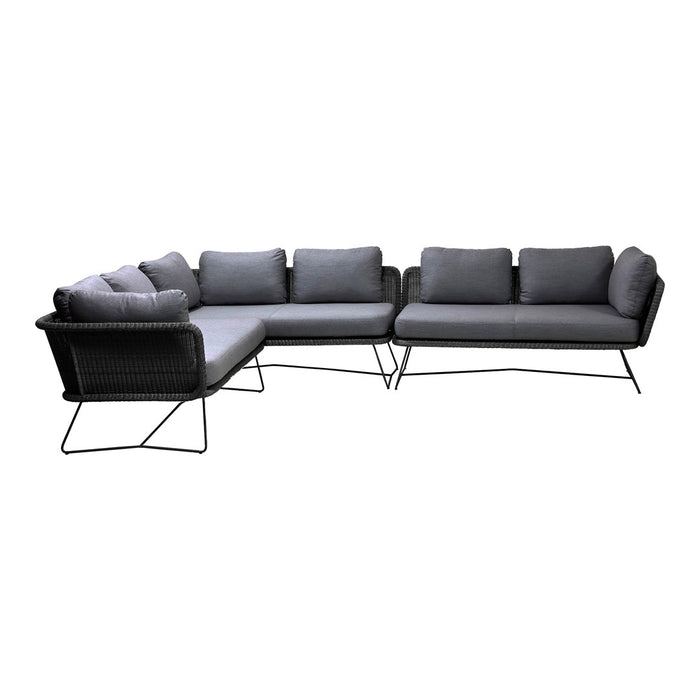 Gray sectional sofa with clean lines and subtle textures, featuring plush cushions for modern elegance.
