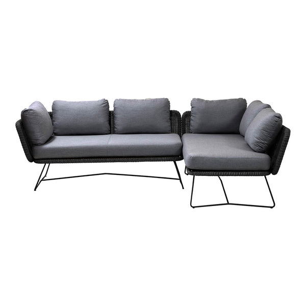 Gray fabric sectional sofa with plush cushions and sleek black metal legs. Modern design with clean lines and textured pattern.
