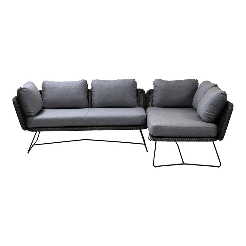 Gray fabric sectional sofa with plush cushions and sleek black metal legs. Modern design with clean lines and textured pattern.