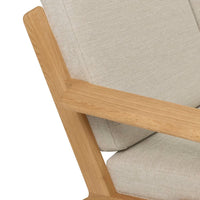 Beige upholstered chair with a light wood frame, showcasing a minimalist design. Perfect for modern decor.