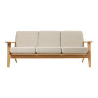 Light beige fabric cushions on a natural wood frame, offering a minimalist and modern design. Perfect for any decor.