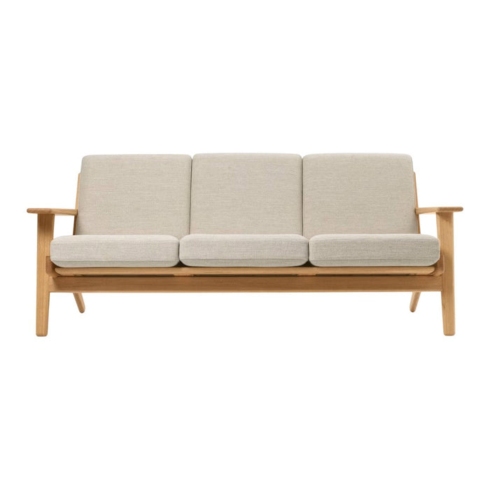Light beige fabric cushions on a natural wood frame, offering a minimalist and modern design. Perfect for any decor.