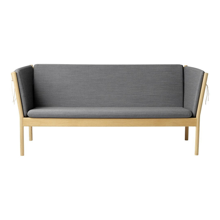 Gray upholstered sofa with wooden frame, featuring a minimalist design and smooth texture, perfect for modern spaces.