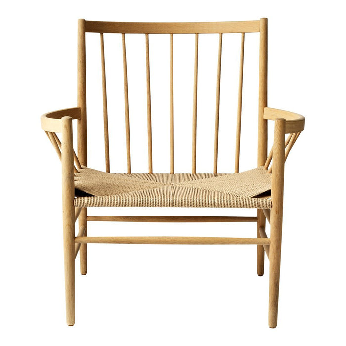 Natural wood chair with vertical slats and woven straw seat, showcasing a minimalist design and warm tones.