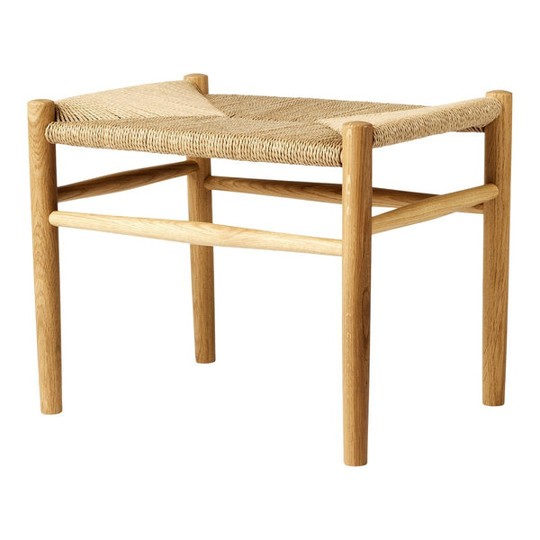 Natural wood stool with a woven jute seat in a beige geometric pattern for a stylish, rustic accent.