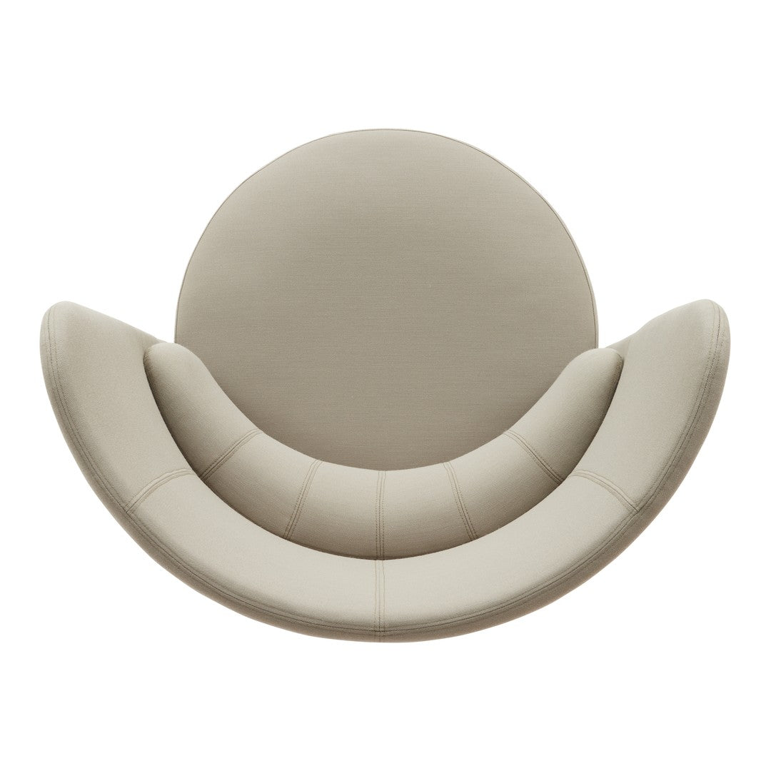 Beige circular chair with smooth, rounded lines and subtle stitching details, adding a soft, modern touch to any space.