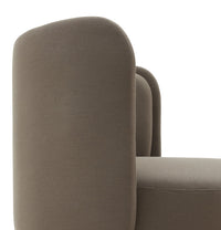 "Soft taupe chair with rounded edges and a textured fabric, perfect for modern home decor."