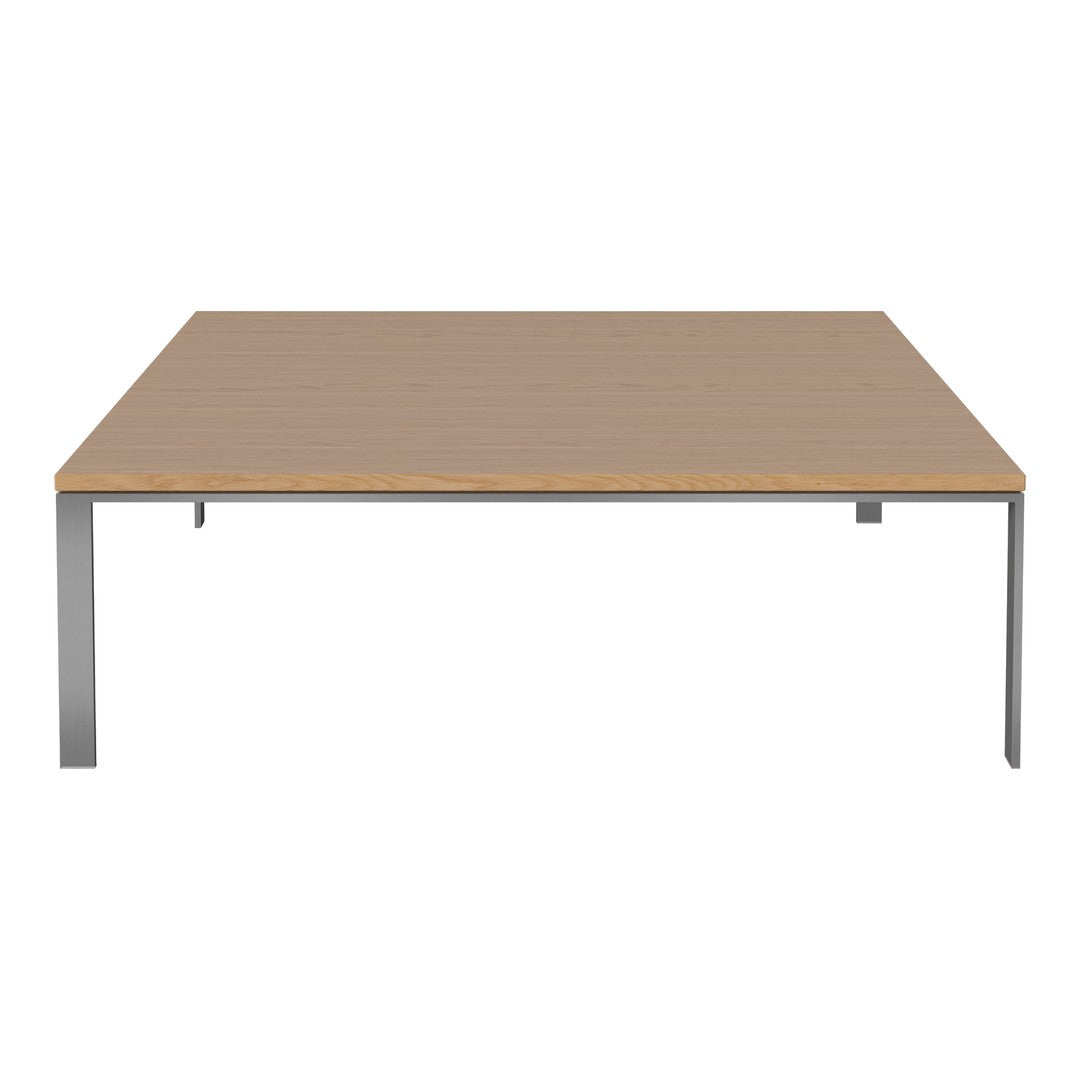 Square tabletop in light wood with a smooth finish, supported by sleek metal legs in a modern design.