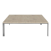 Beige textured tabletop with modern gray metal legs, featuring a minimalist design perfect for contemporary spaces.