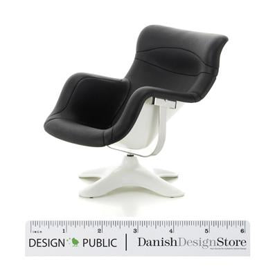 Stylish black swivel chair with smooth curves and a white base, perfect for modern interiors.