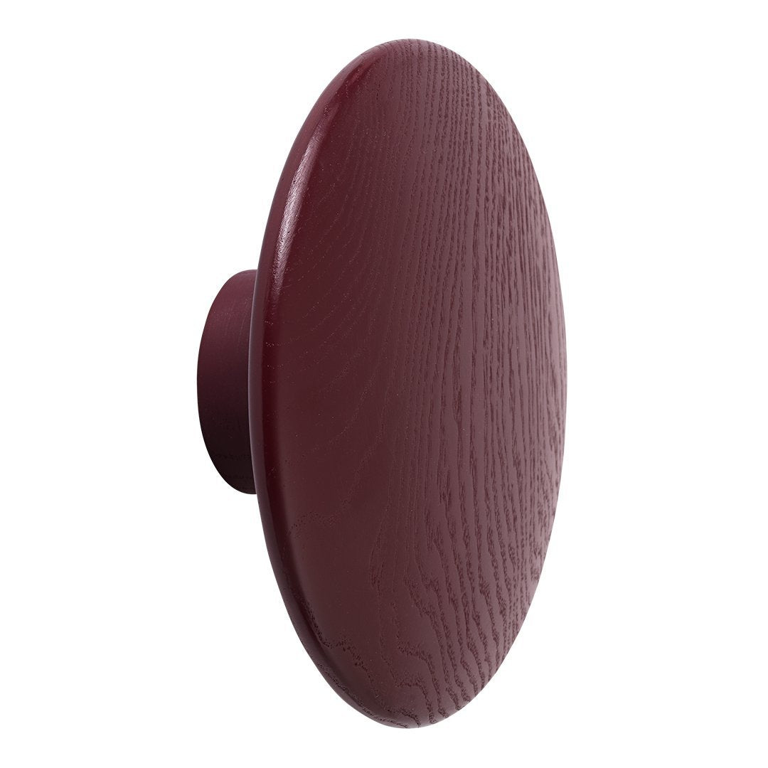 Deep burgundy round wall knob with a textured wood grain finish. Ideal for chic home decor.
