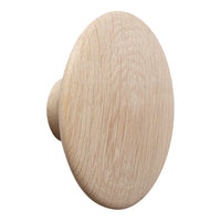 Natural wood knob with a smooth, oval shape and light oak finish, featuring a subtle grain pattern.
