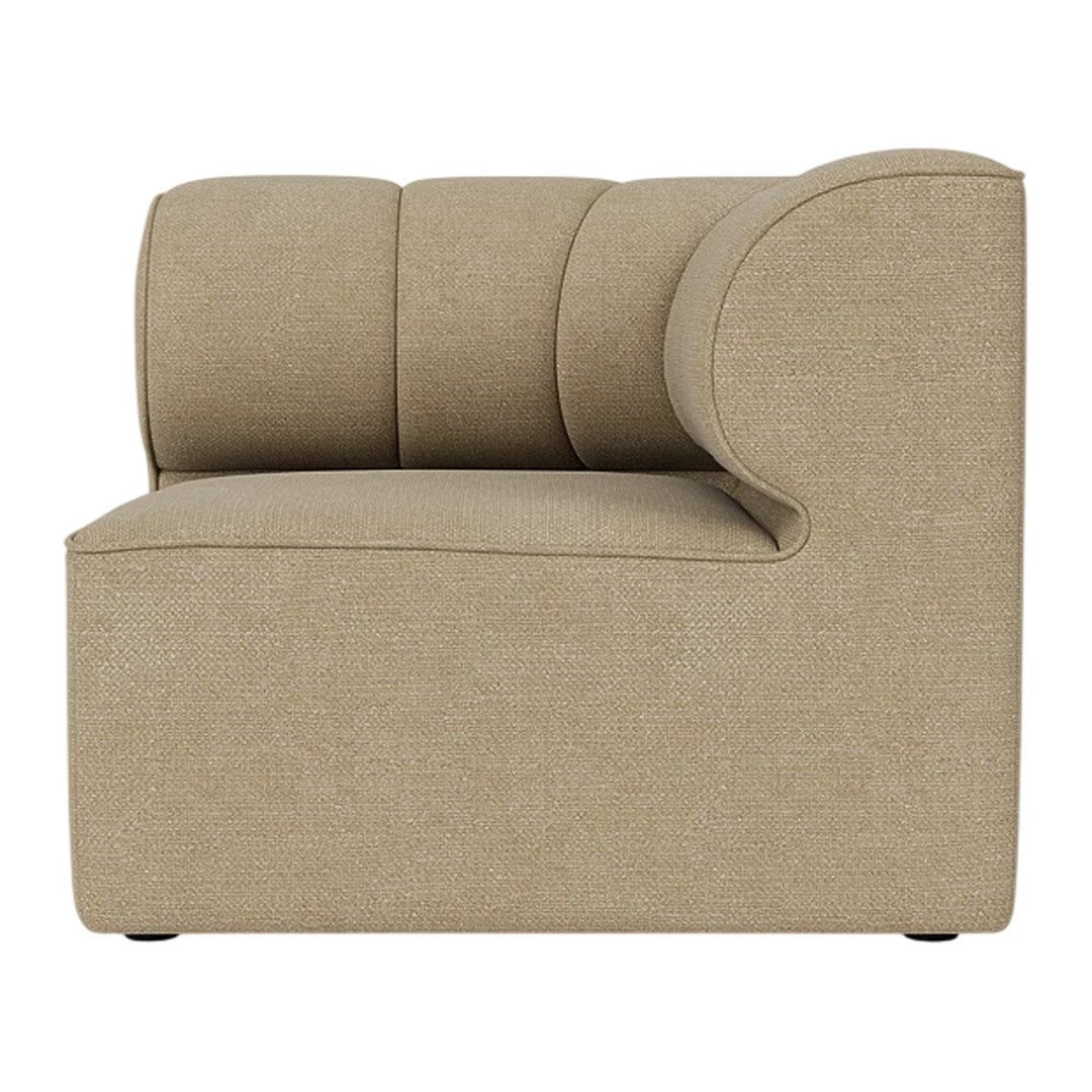 Beige upholstered sofa segment with rounded edges and a smooth texture, featuring subtle, minimalist design.