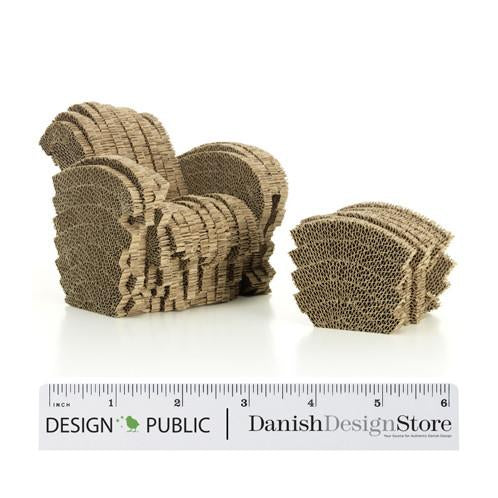 Brown textured cardboard chair and ottoman with layered patterns, perfect for unique decor.