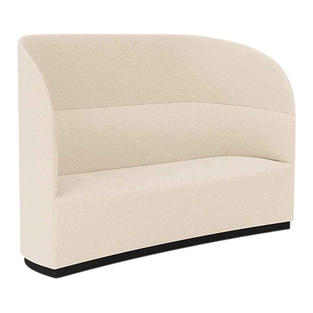 Curved beige sofa with a smooth texture, featuring a sleek black base for a modern look.