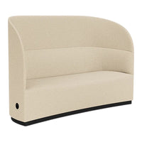 Beige curved sofa with a smooth texture and sleek black base, perfect for modern interiors.