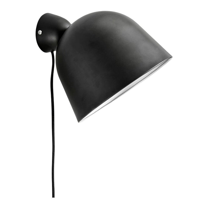 Black metal wall lamp with a smooth, curved dome shape and a sleek black cord, perfect for modern interiors.
