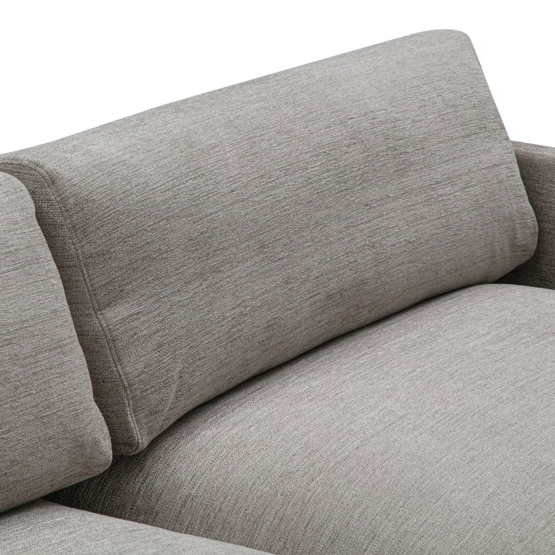 Soft gray upholstery with a subtle textured pattern on a modern sofa. Perfect for contemporary living spaces.