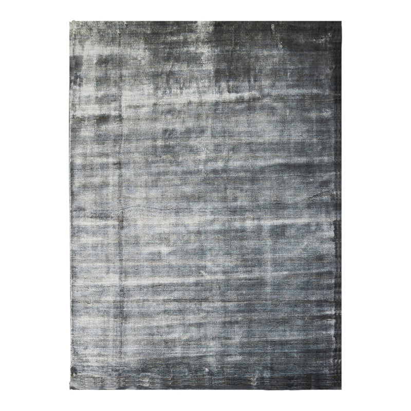 Gray textured area rug with a subtle pattern, featuring varying shades of light and dark gray.