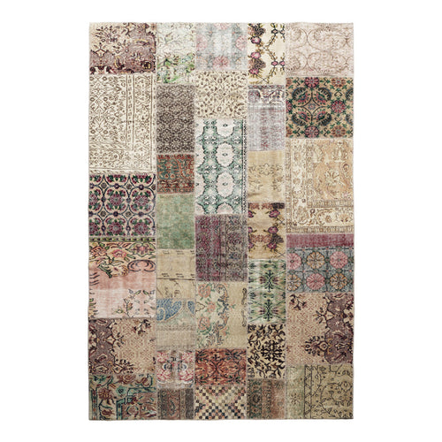 Multicolor patchwork rug featuring intricate patterns in muted tones of beige, green, burgundy, and cream.