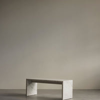 Minimalist gray marble table with subtle white veining against a neutral background. Perfect for modern decor.