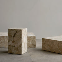 Neutral-toned geometric stone blocks with unique textured patterns, ideal for modern decor.