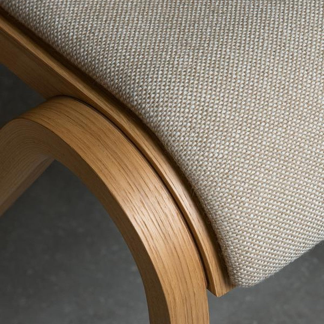 Light beige textured fabric with natural wood accents, showcasing a modern, minimalist design.