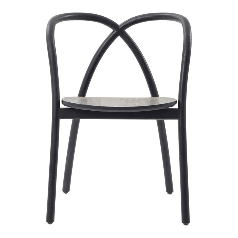 Black wooden chair with a minimalist design and curved backrest, featuring a natural wood seat.