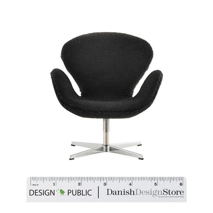 Black textured swivel chair with a sleek metal base, featuring a modern minimalist design. Perfect for stylish interiors.