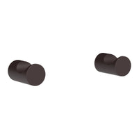 Matte brown round knobs with a sleek, modern design for stylish accents in home decor.