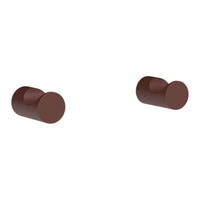 Brown cylindrical knobs with a smooth, matte finish. Ideal for modern home decor and furniture upgrades.