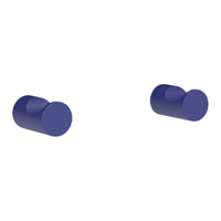 Two round, deep blue knobs with a smooth finish against a white background. Ideal for modern decor.
