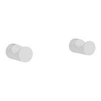 White minimalist round wall hooks with a smooth matte finish, perfect for modern decor.
